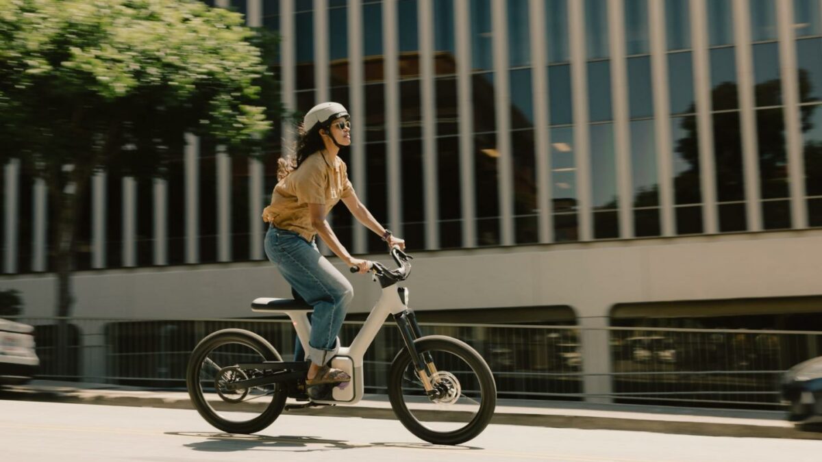 a woman rides an ALSO autonomous bike