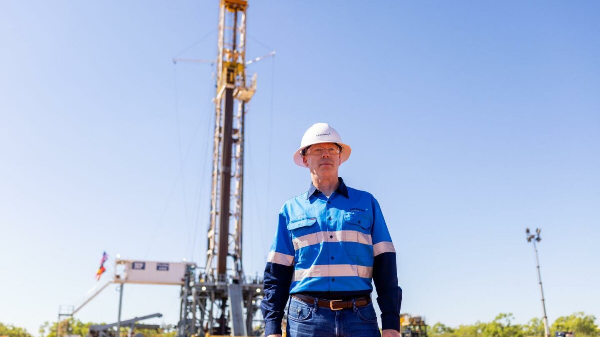 Tamboran Resources CEO stands in front of an H&P drilling rig shipped from the U.S. to Australia's Beetaloo Basin.