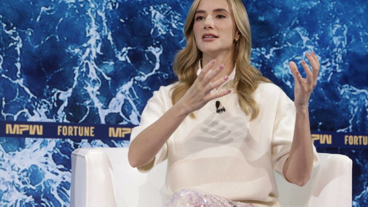 Woman raises her hands to emphasize