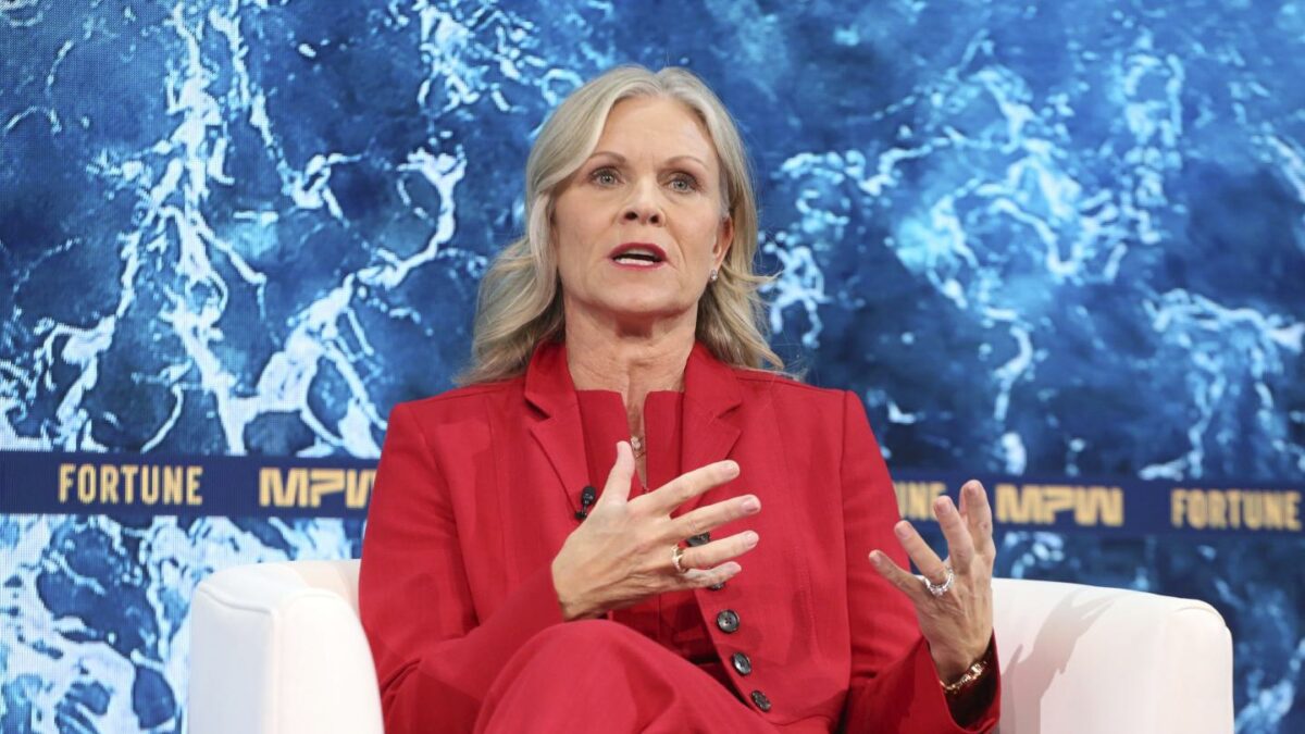 Woman in a red suit talking