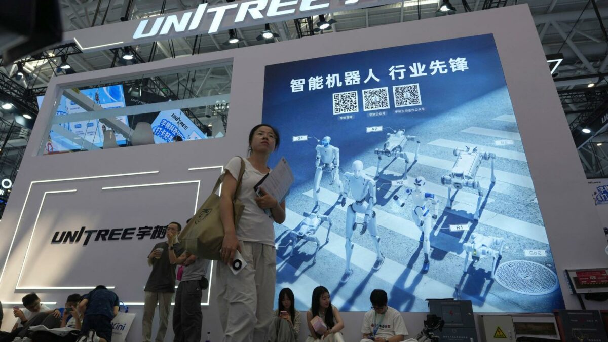 Photo of people at Unitree booth at a world robot conference