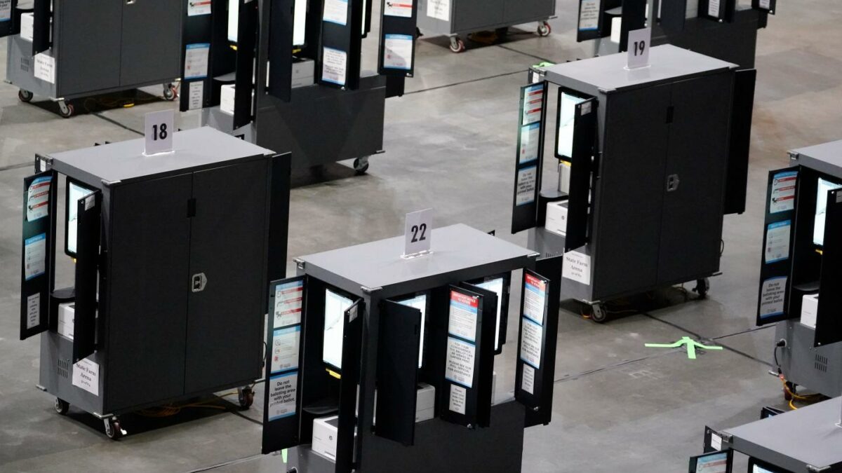 Voting machines fill the floor for early voting at State Farm Arena, Oct. 12, 2020, in Atlanta.