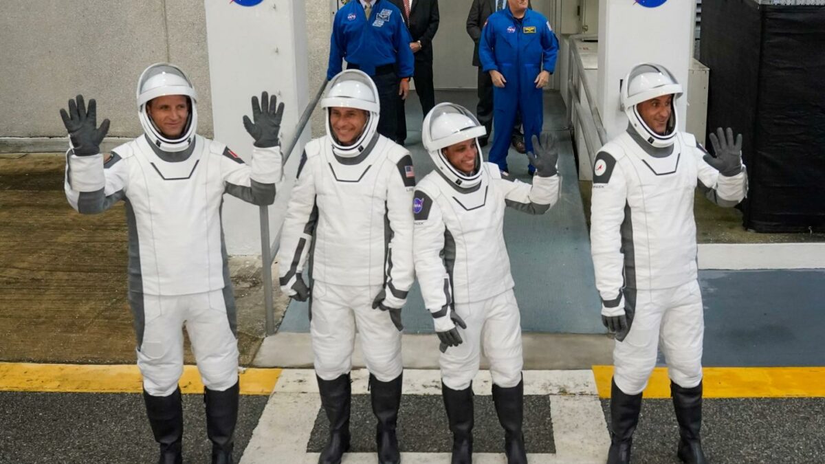 Astronauts, from left, Joshua Kutryk, of Canada, pilot Luke Delaney, commander Jessica Watkins and Cosmonaut Sergey Teteryatnikov, of Russia leave the Operations and Checkout Building at the Kennedy Space Center in Cape Canaveral, Fla.