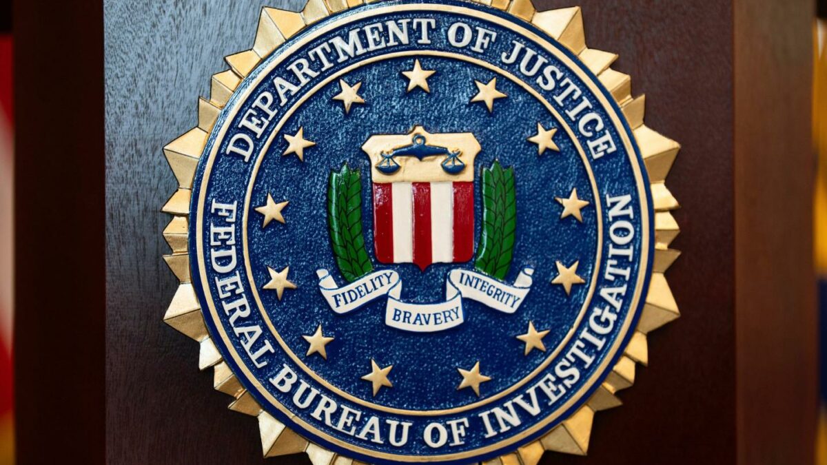 An FBI seal is displayed on a podium before a news conference at the field office in Portland, Ore.