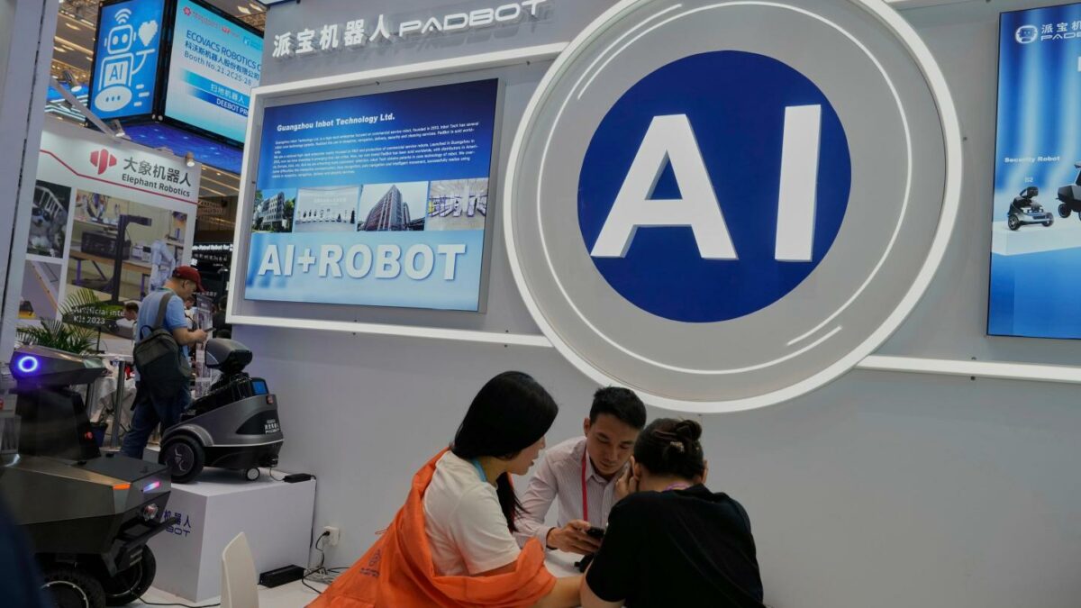 Vendors for AI enabled robots wait for customers at the 137th Canton Fair in Guangzhou in southern China's Guangdong province.
