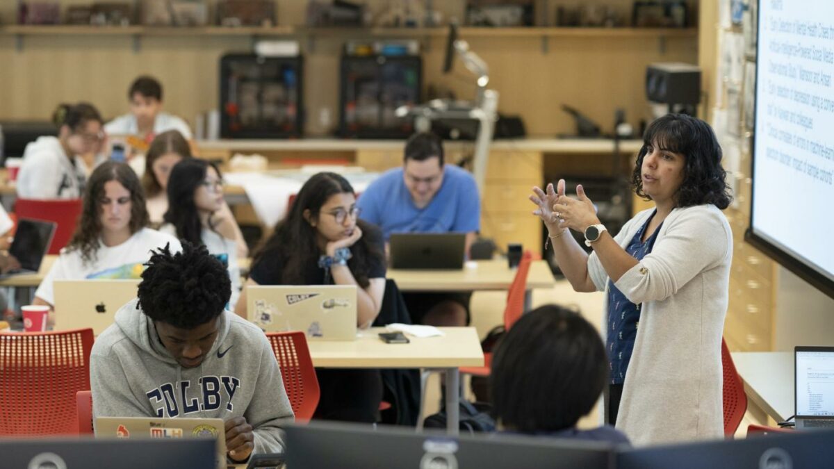 Assistant Professor of Psychology Veronica Romero lectures during the Davis Institute's Interdisciplinary Summer Bridges Program. Colby College students: Nabeela Ali '29, Christian Dwamenah, also pictured.