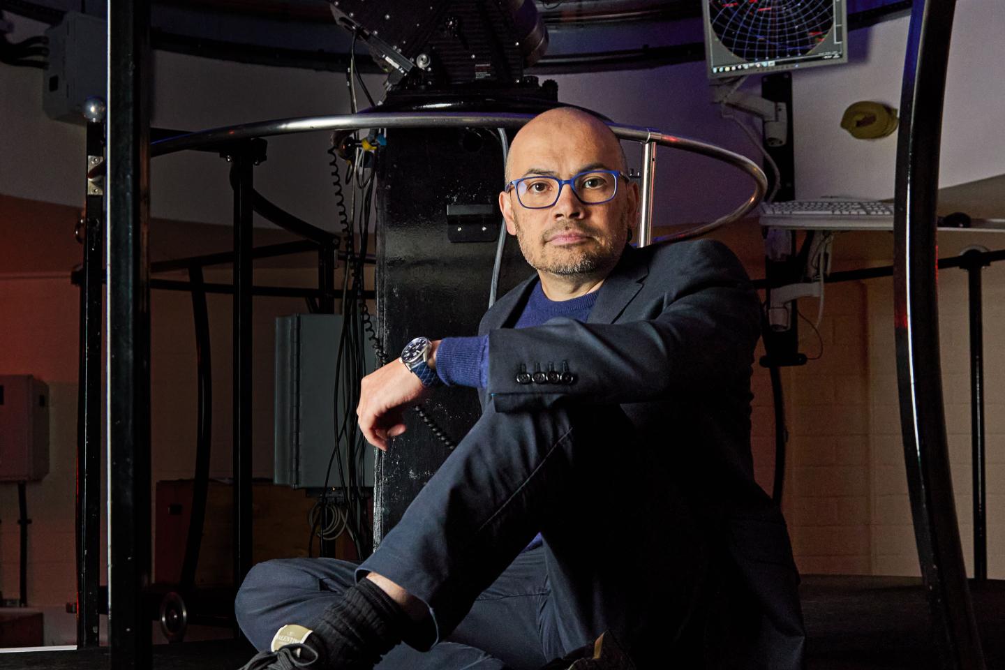 Demis Hassabis in front of the Fry Telescope.
at  the UCL (University College London) Observatory.