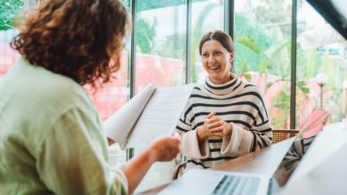 Woman manager interviews a job candidate using laptop to evaluate job seeker qualifications