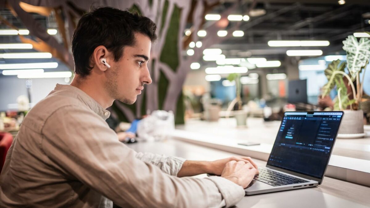 Young worker in an office on a laptop
