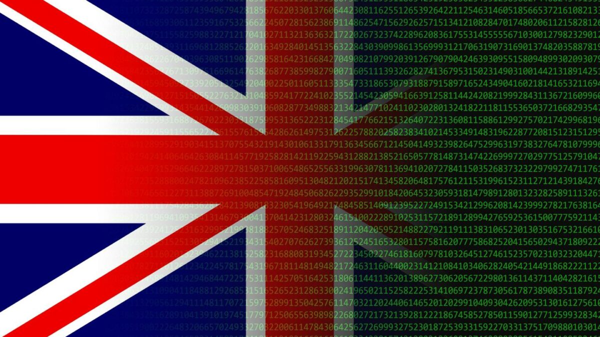 Photo of British flag blending into computer code in green type on a black screen.