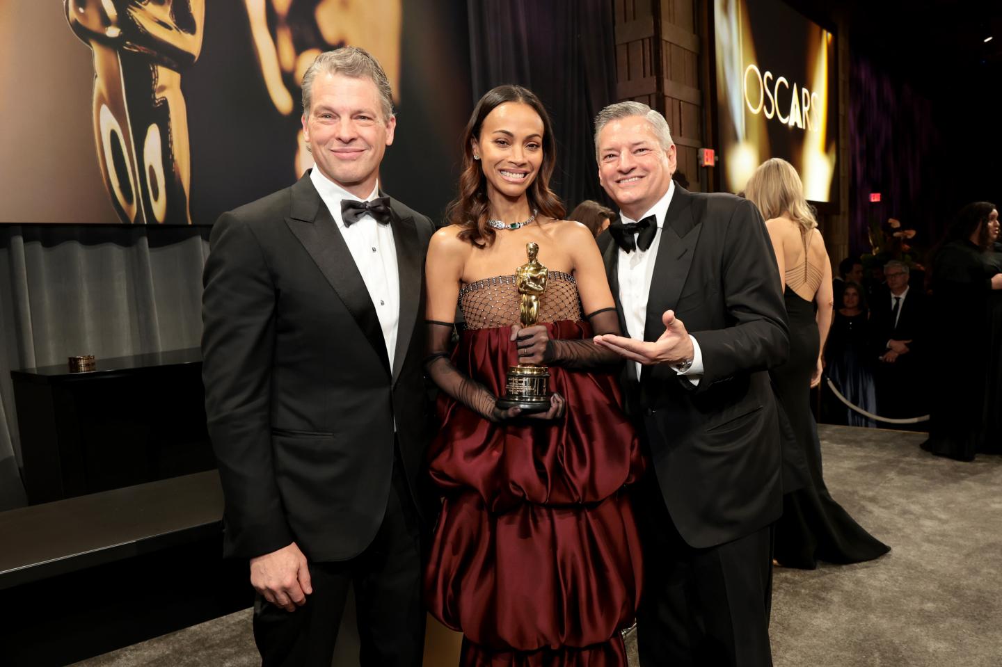 gettyimages-2202964650-1 Netflix co-CEOs Greg Peters (left) and Ted Sarandos (right) with actor Zoe SaldaƱa on March 02, 2025 in Hollywood, California. (Photo: Monica Schipper/Getty Images)