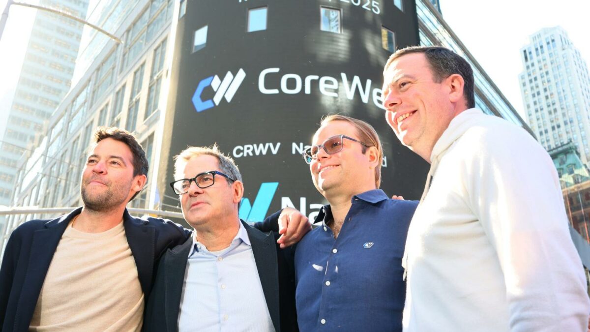 CoreWeave executives pose in front of the Nasdaq building on the day of the company's IPO.
