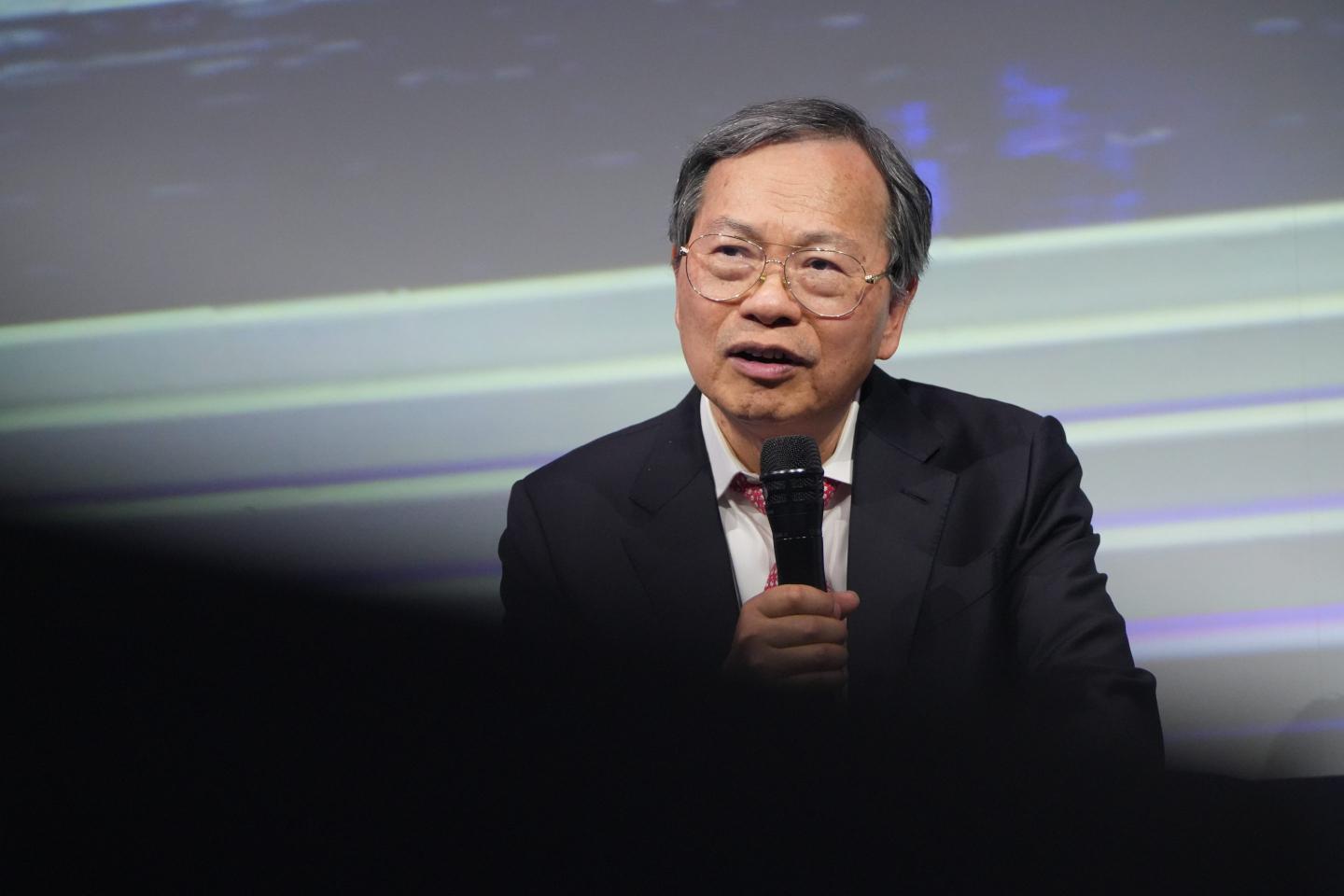 Man in a suit with a microphone