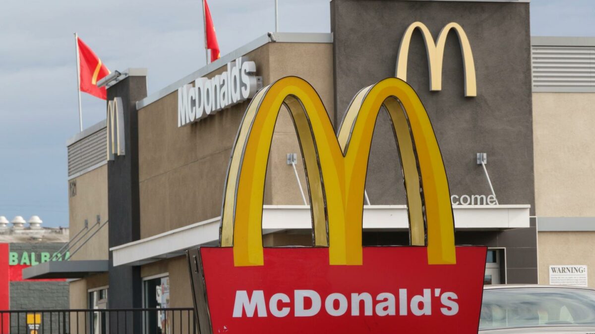 A McDonald's logo is displayed on a sign outside a restaurant in San Diego, CA.