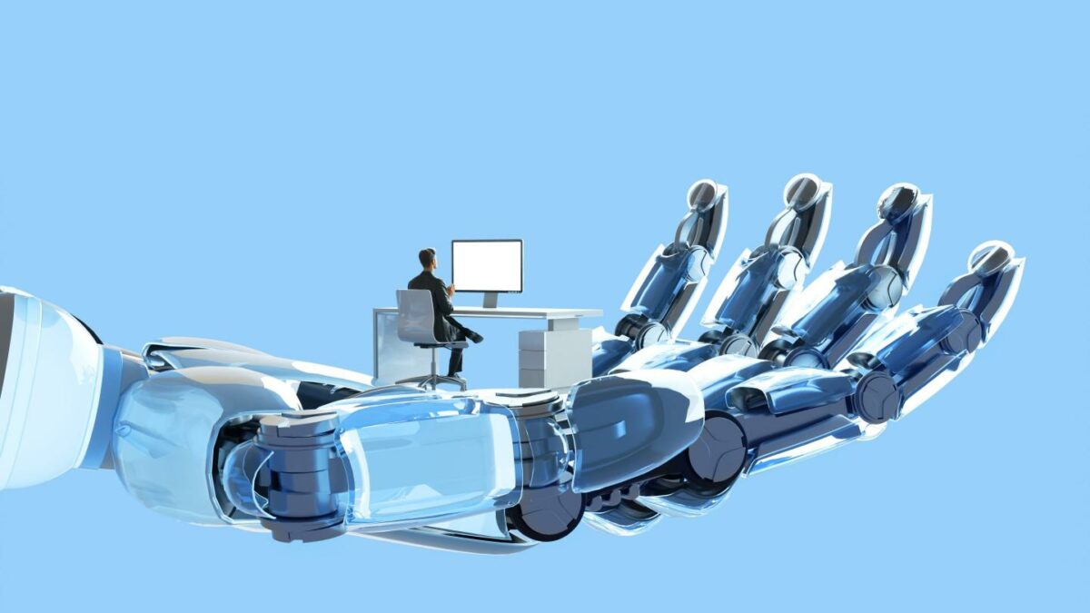 Digital illustration of robot's hand holding and supporting man who is working on his desk using computer, represent themes of artificial intelligence (AI), the future of work, and the intersection of humanity and technology.