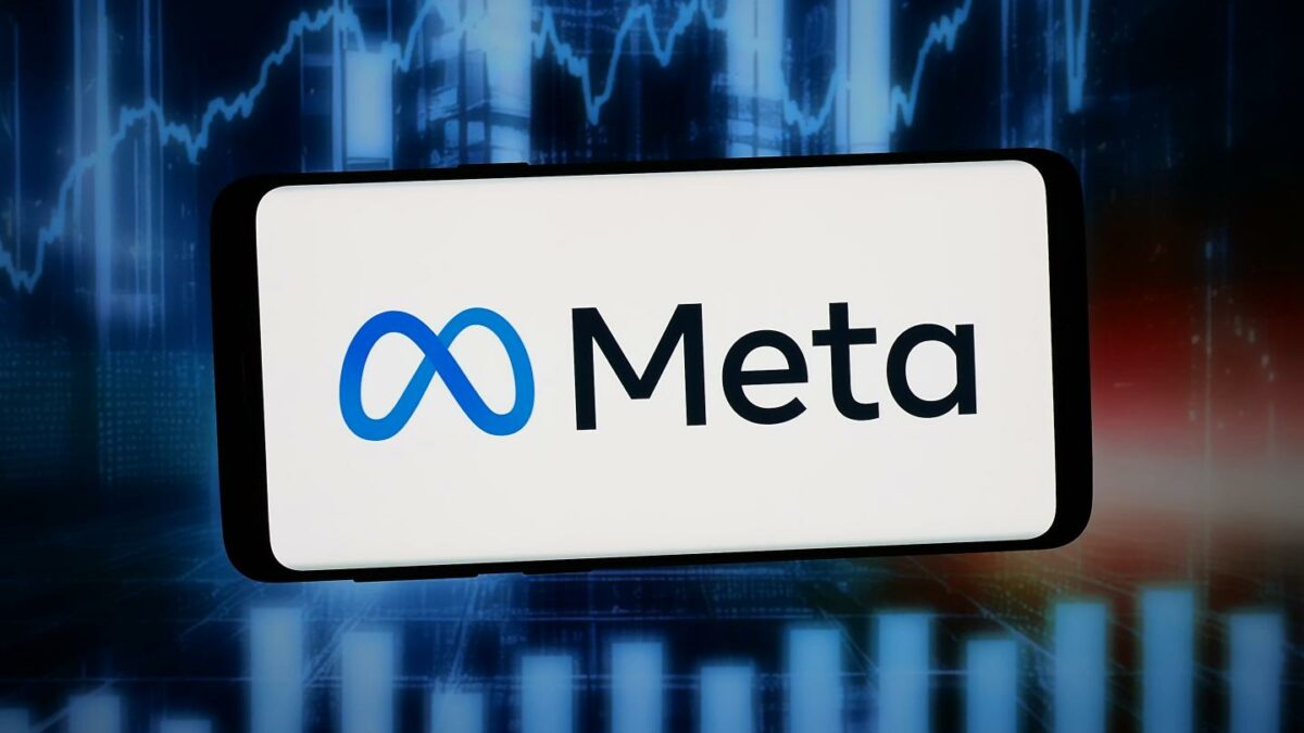 The logo of US technology company Meta Platforms Inc. is displayed on a smartphone in front of abstract background on computer screen.