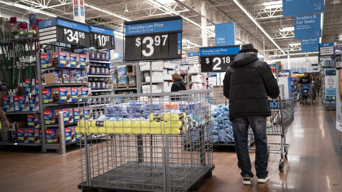 A Walmart shopper browses the aisles as the retailer’s pricing patents draw scrutiny.