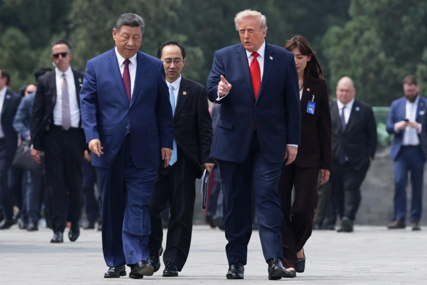 gettyimages-2276140965-e1786922359597-1 Donald Trump and Chinese President Xi Jinping walk side by side