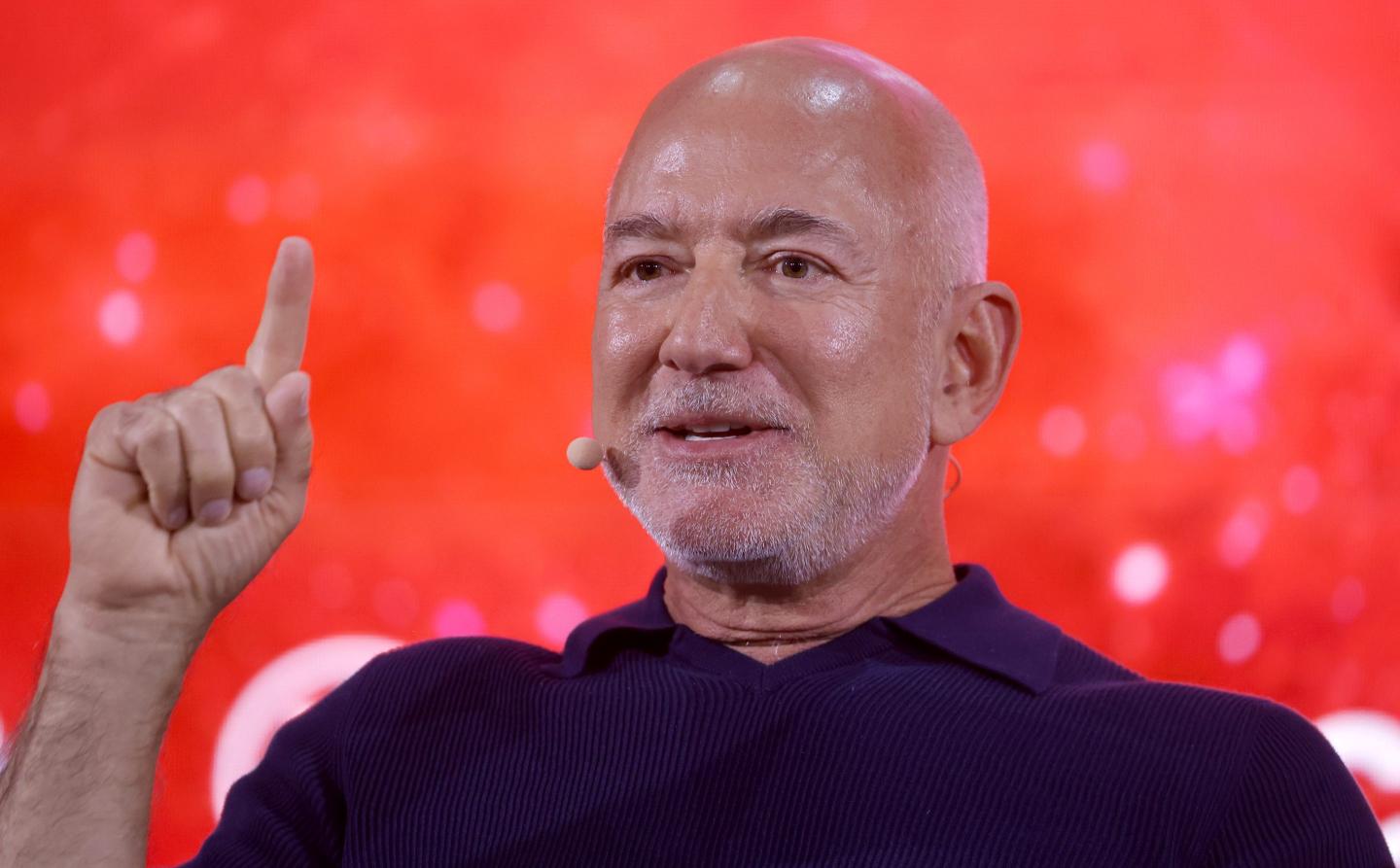 Jeff Bezos holding one finger up