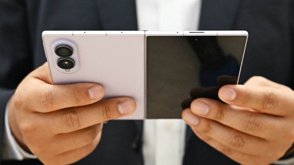 A customer tries out a newly-released Samsung Galaxy Z Fold8 smartphone at a Samsung store.