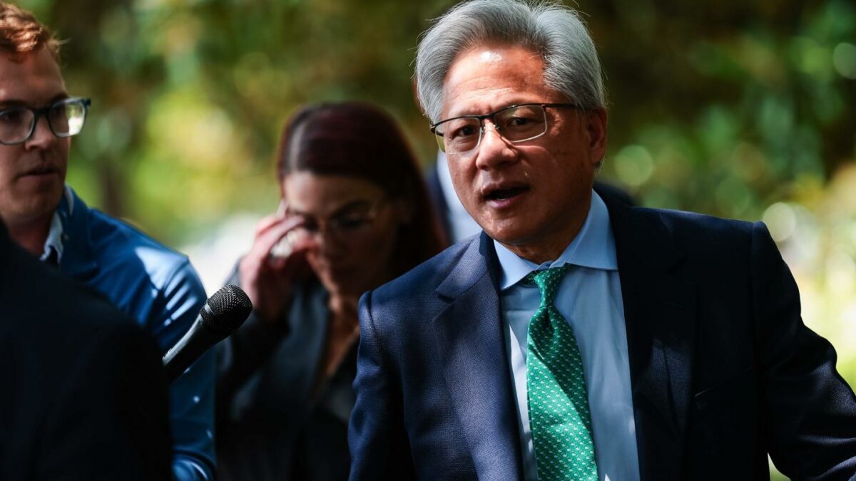 Nvidia CEO Jensen Huang talks to members of the press as he leaves the Hart Senate Office Building on July 28, 2026 in Washington, DC.