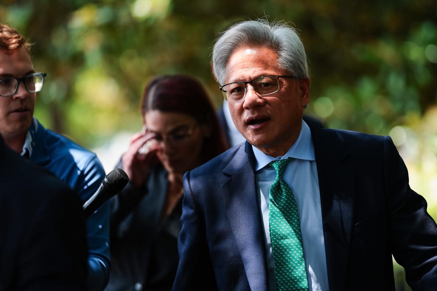 Nvidia CEO Jensen Huang talks to members of the press as he leaves the Hart Senate Office Building on July 28, 2026 in Washington, DC.