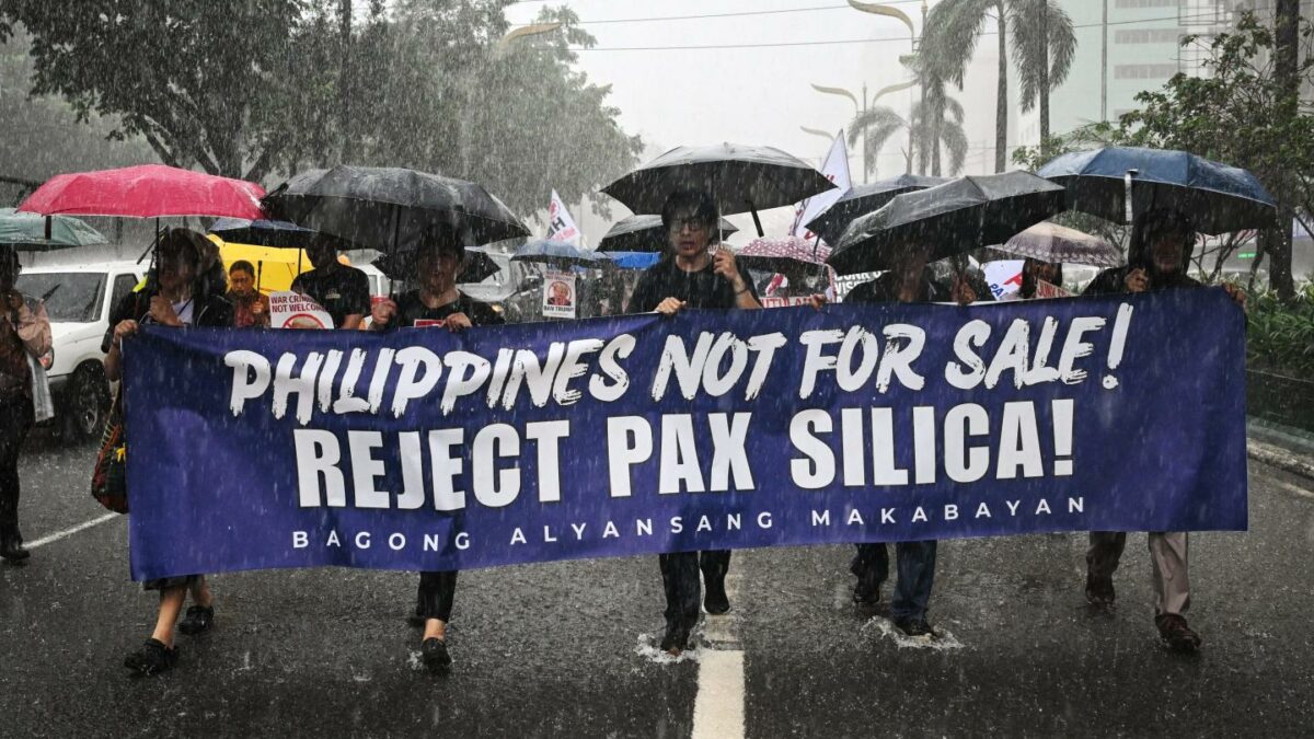People march as they protest against Pax Silica, a U.S.-led initiative, in Manila on August 13, 2026.
