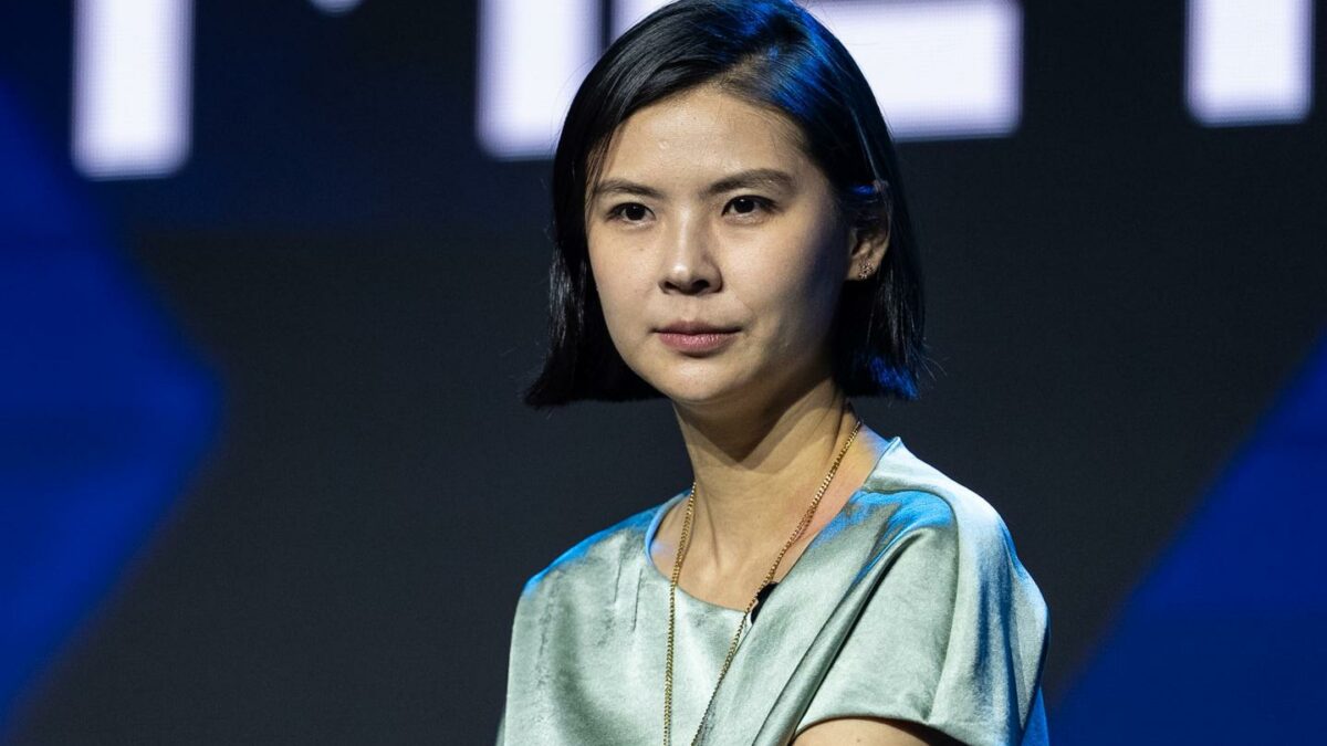 Bitget CEO Gracy Chen sits and looks off into the distance during a conference panel.