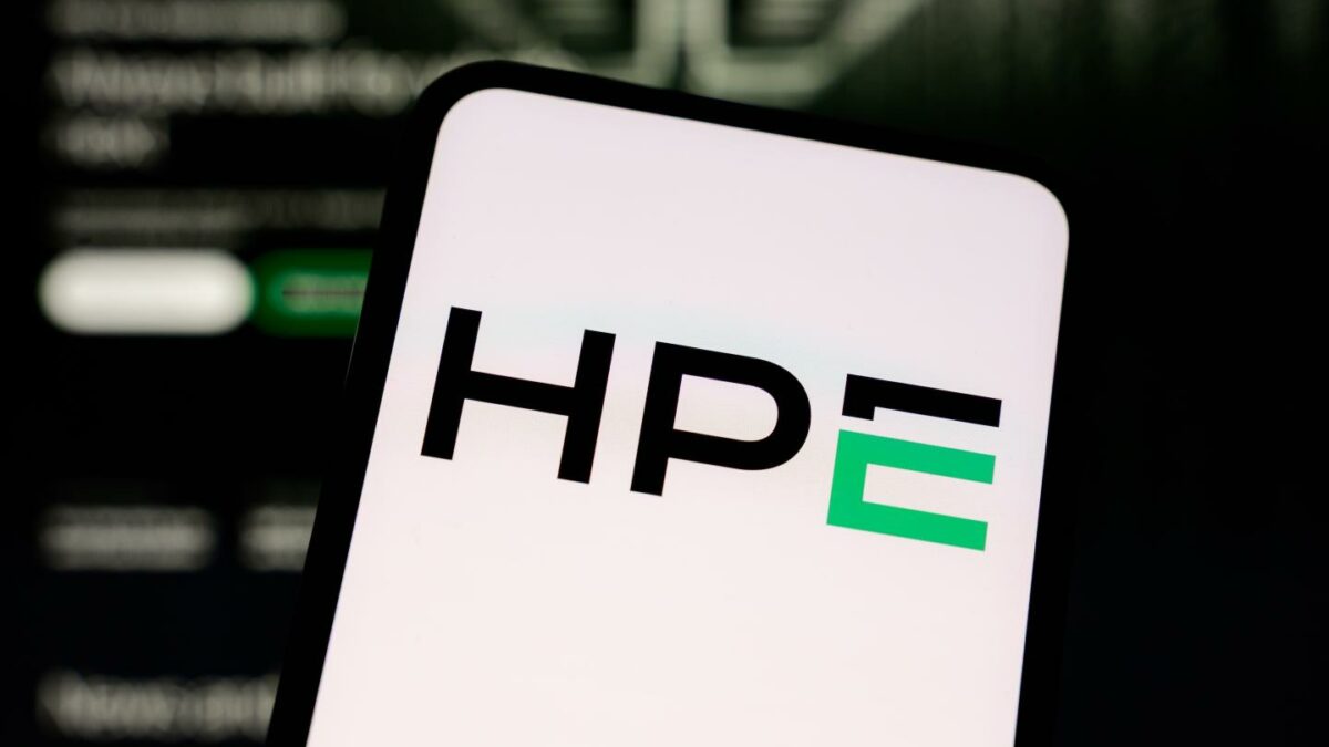 The Hewlett Packard Enterprise (HPE) logo is displayed on a smartphone screen with the company's website in the background.