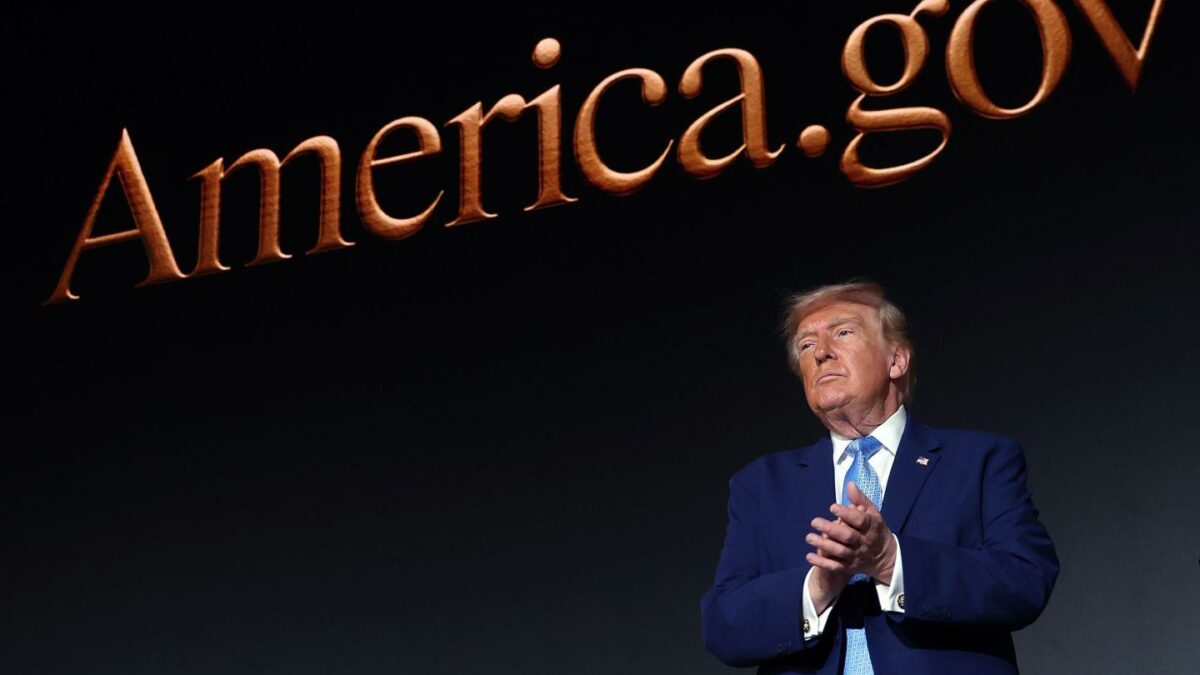 President Donald Trump applauds on stage during the America.gov launch event at Andrew W. Mellon Auditorium on September 29, 2026 in Washington, DC. The website features an artificial intelligence tool to help Americans interact with the federal government.