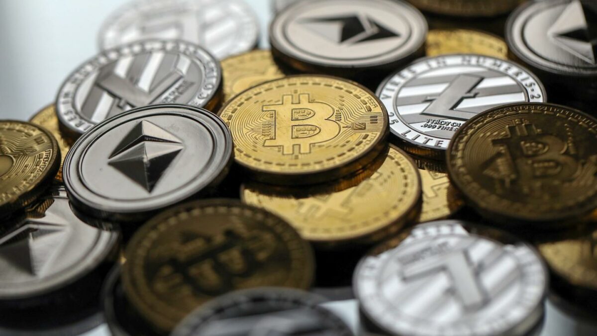 A display of physically cryptocurrencies including Bitcoin, Ethereum and Tether.