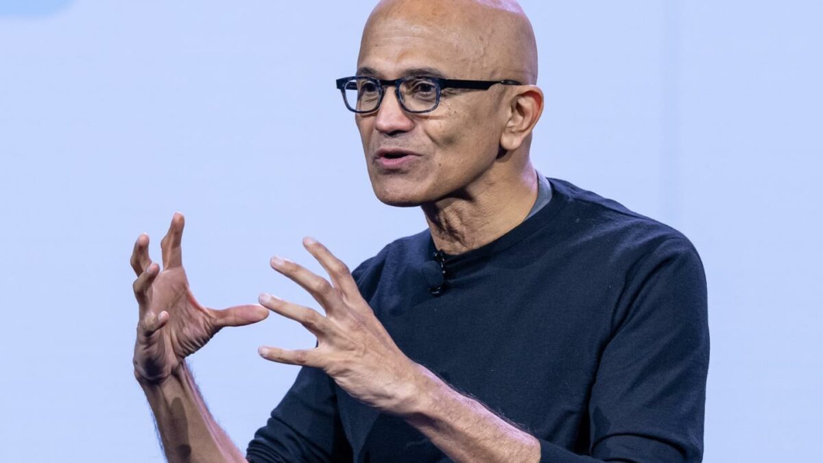 Satya Nadella gestures with both hands