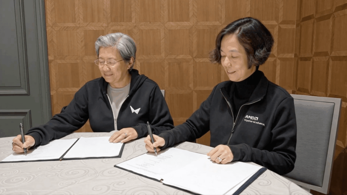 AMD CEO Lisa Su (left) and World Labs CEO Fei-Fei Li sign the deal bringing the two companies together.