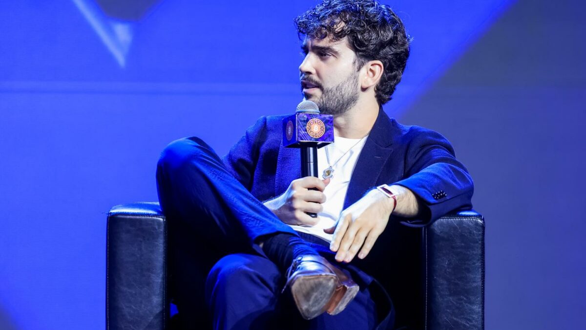 seated man and microphone